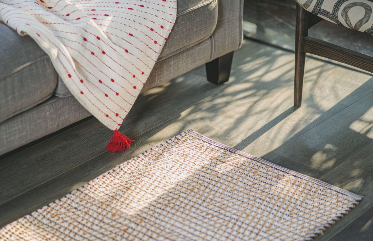 A modern carpet with a neutral woven texture.